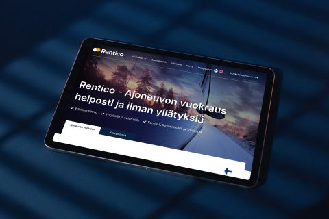 Autovuokraamo Renticon uudet verkkosivut ja yritysilme tabletin näytöllä tummansinisellä pinnalla