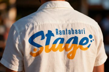 Rantabaari Stagen logo vaalean paidan selässä