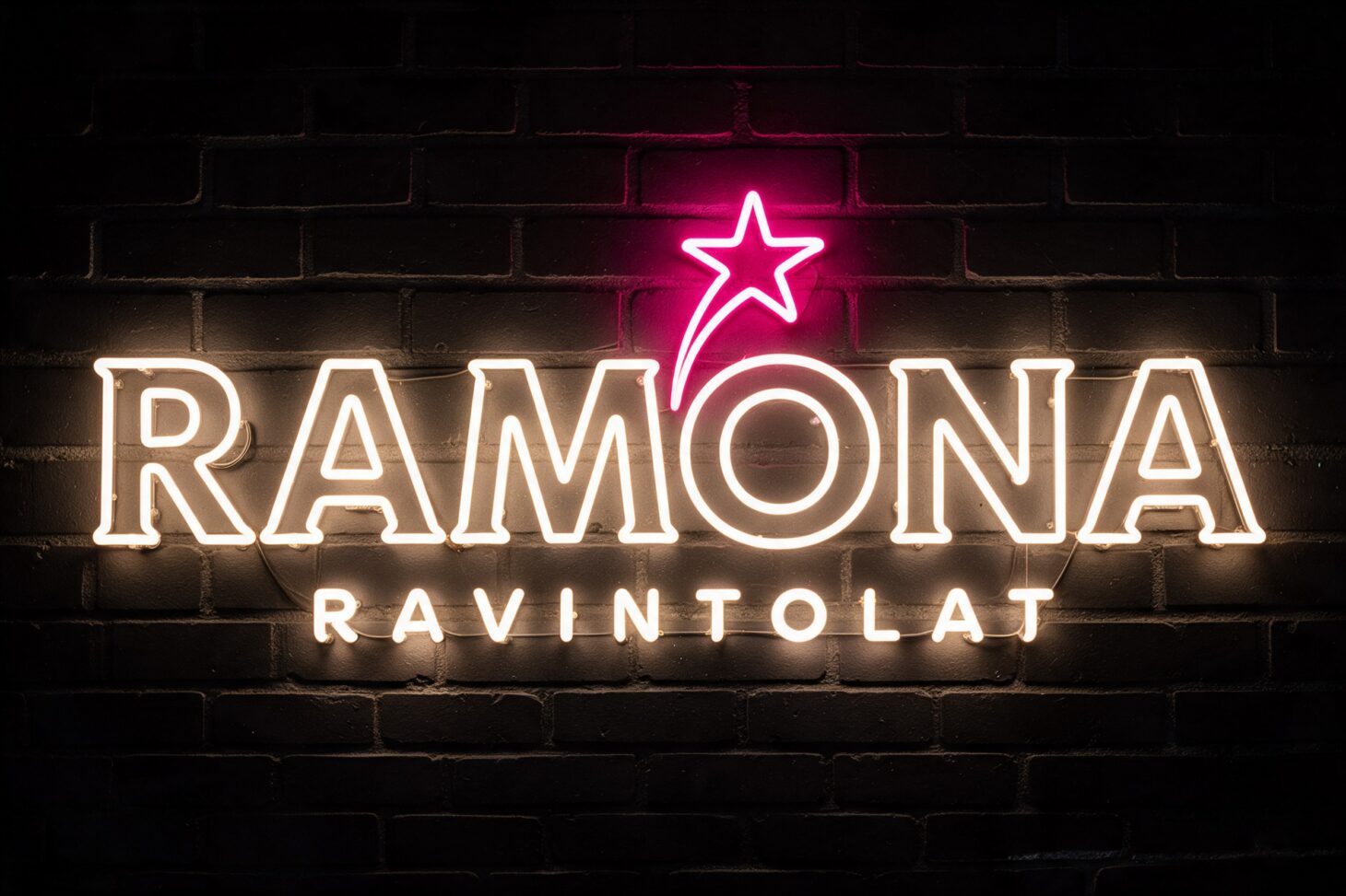 Ramonan logo neonvalona tiiliseinällä
